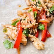 skillet chicken fajita filling on top of a flour tortilla
