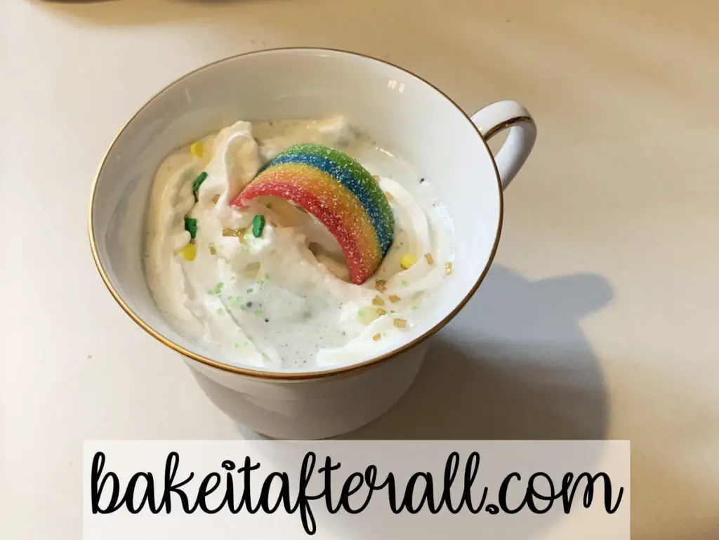 Shamrock shake with whipped cream and rainbow fruit