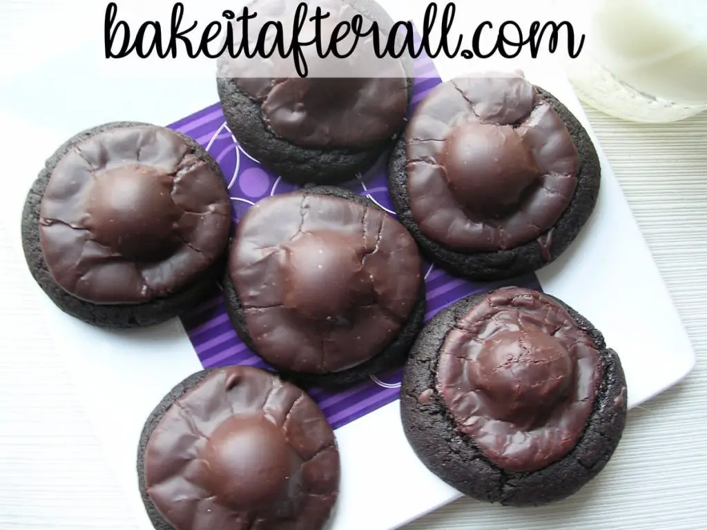 dark chocolate covered cherry cookies on a white plate