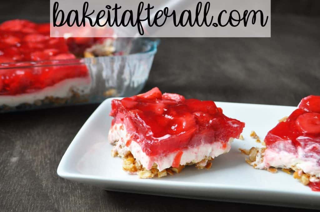 strawberry pretzel jello salad on a white plate