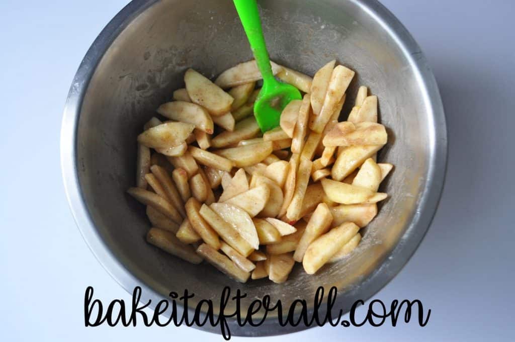 apple pie filling in a bowl with a small silicone spatula