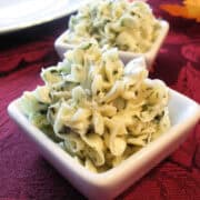 two dishes of compound herb butter on a fall table