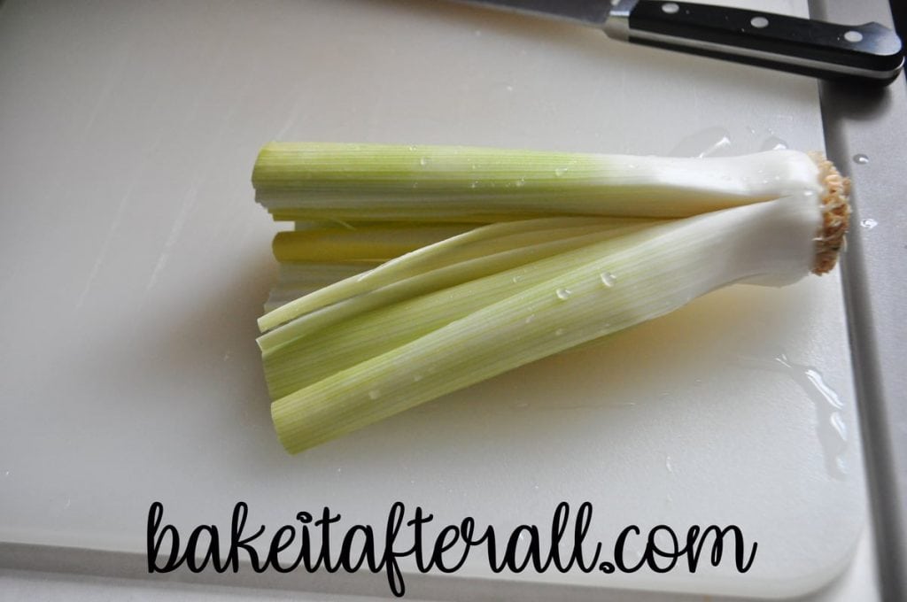 leek spread out on cutting board