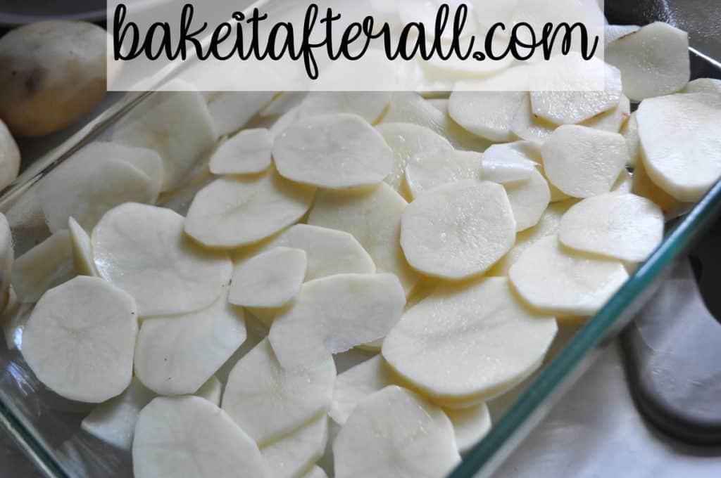 potato slices in a casserole dish