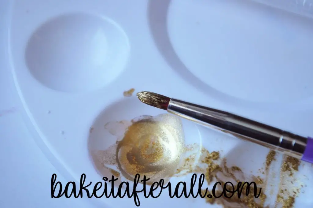 gold luster dust on a paintbrush