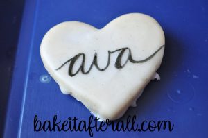 "ava" written on a cookie in calligraphy