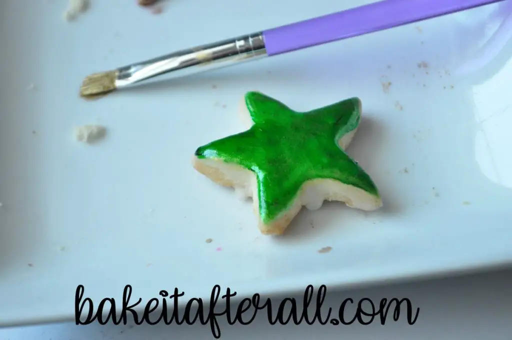 green painted star shaped cookie for the Painted Rainbow Cookies