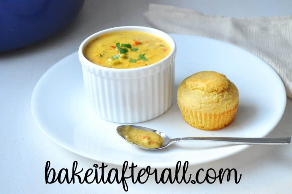 Gluten Free Broccoli Cheddar Soup in a bowl with a cornbread muffin on the side