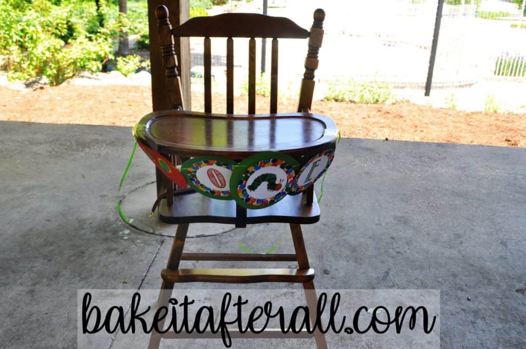 wooden high chair with high chair banner