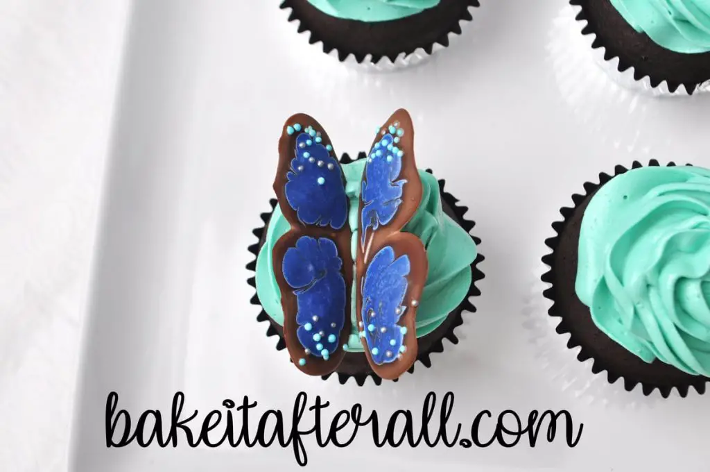 butterfly wings pressed into the top of the cupcake