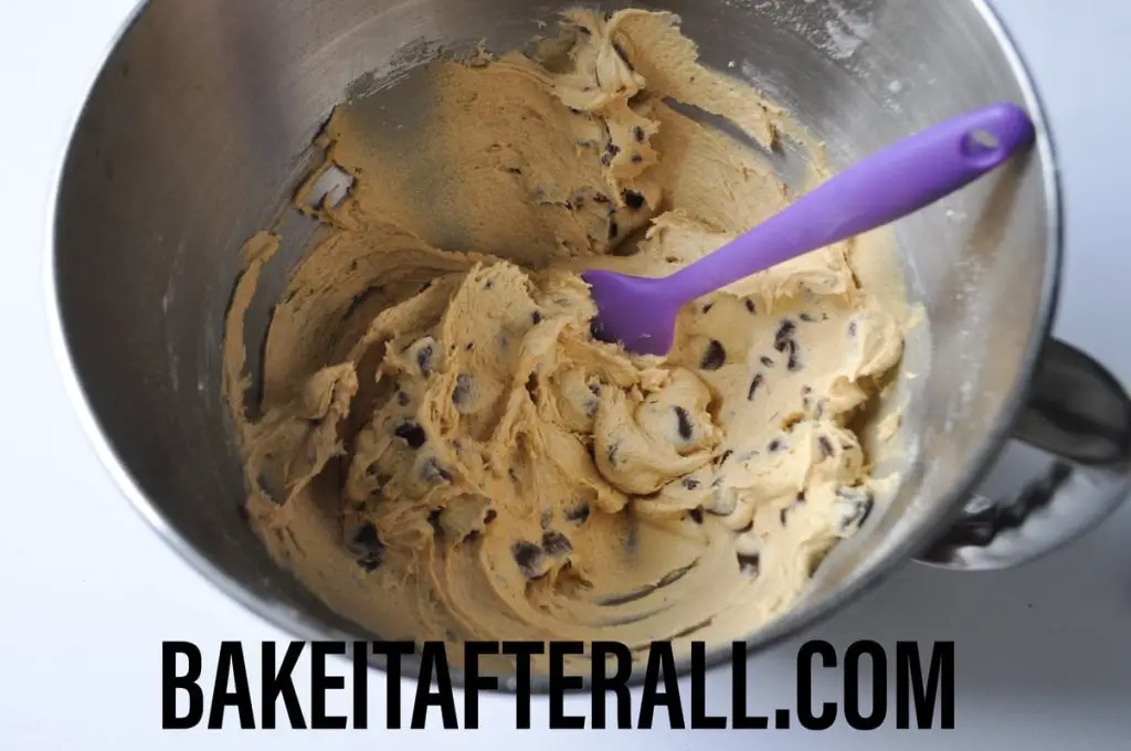 cookie dough in a bowl with a silicone spatula