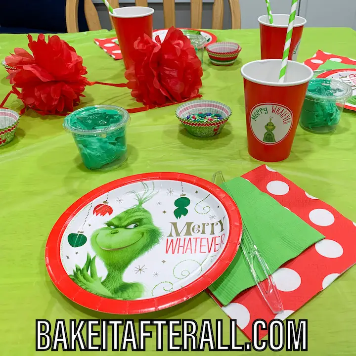 Grinch place settings for a Grinch themed holiday party