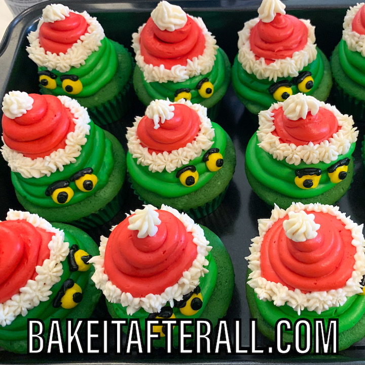Grinch cupcakes in a container