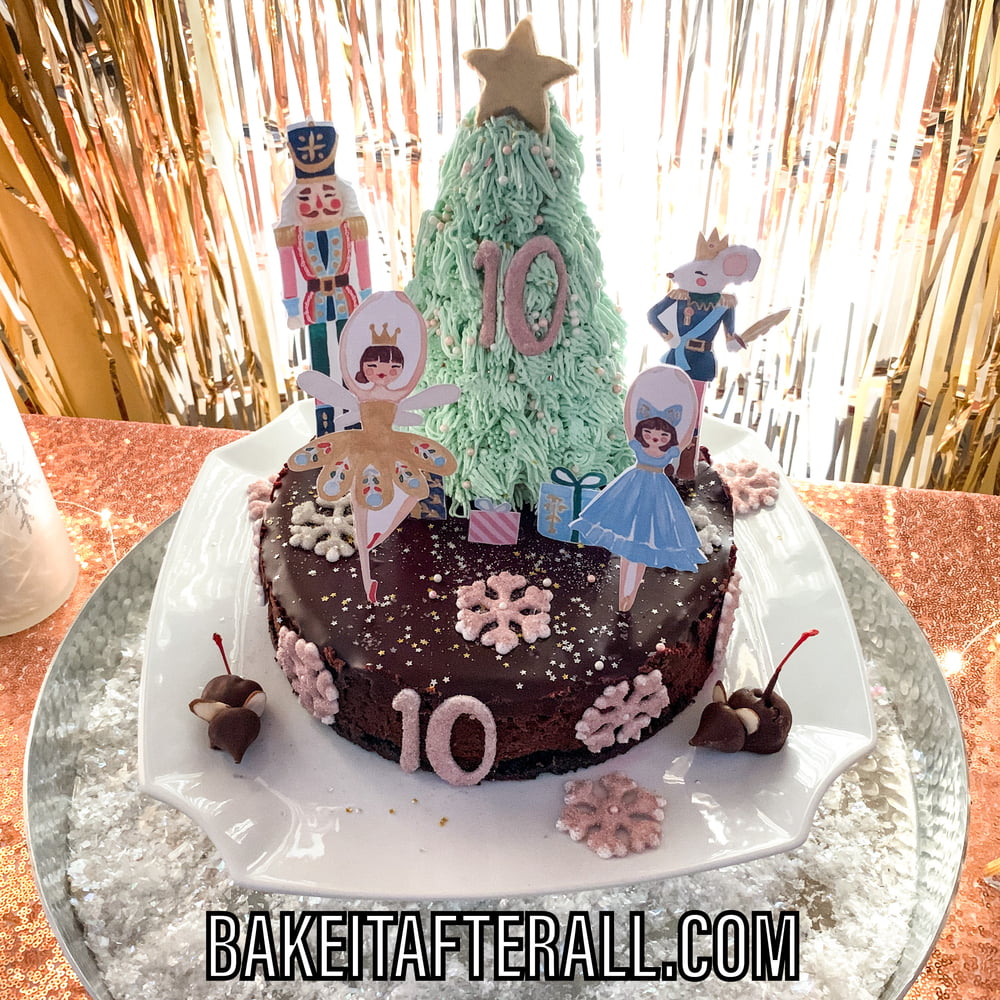 Mocha cheesecake decorated with vanilla buttercream and royal icing transfers for Nutcracker party theme