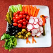 a turkey relish tray on a burnt orange colored tablecloth