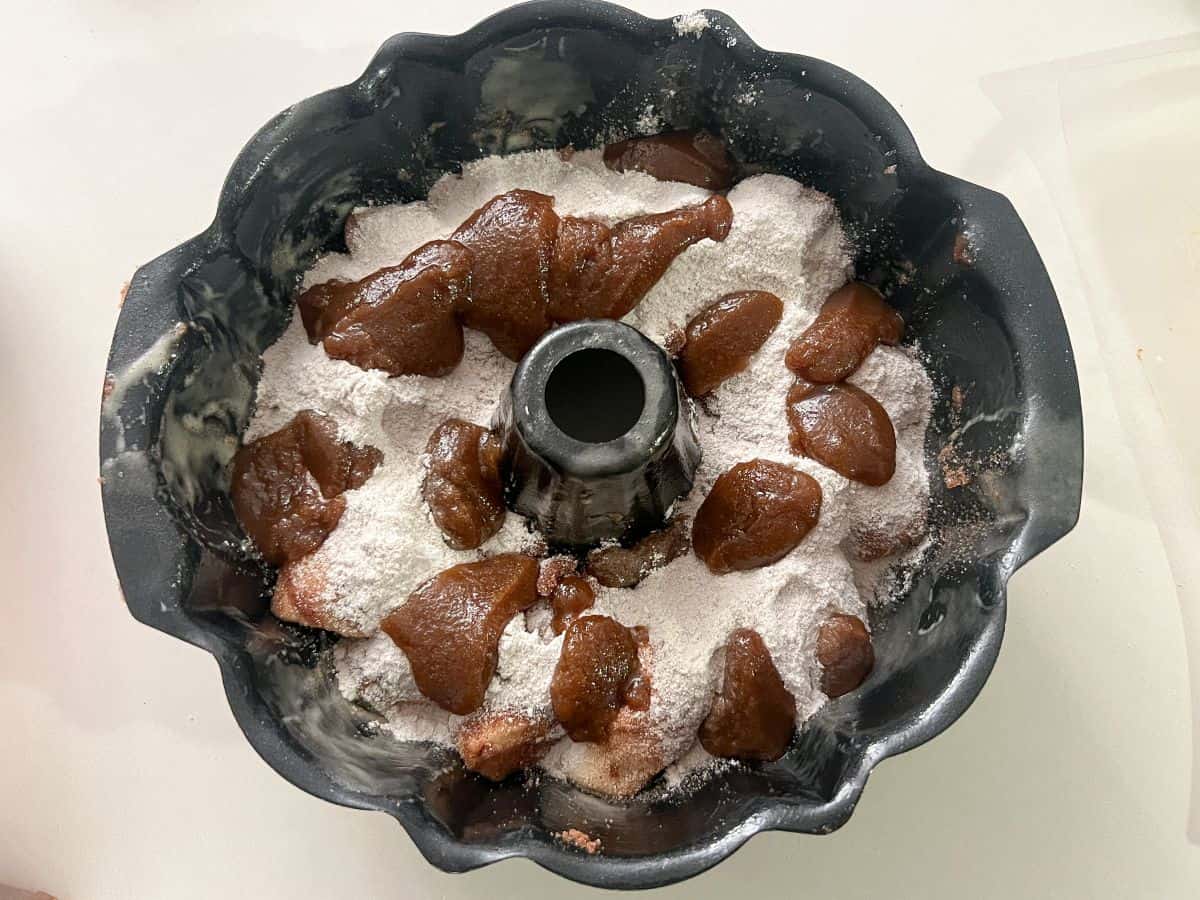 brown sugar mixture on top of bread dough in a Bundt pan