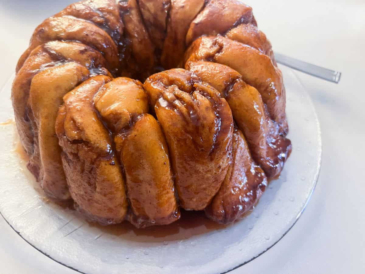 overnight monkey bread inverted on a glass pan