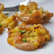crash hot potatoes on a white plate