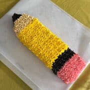 pencil cake on a parchment paper lined cookie sheet