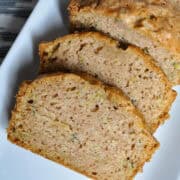 zucchini bread sliced on a white plate