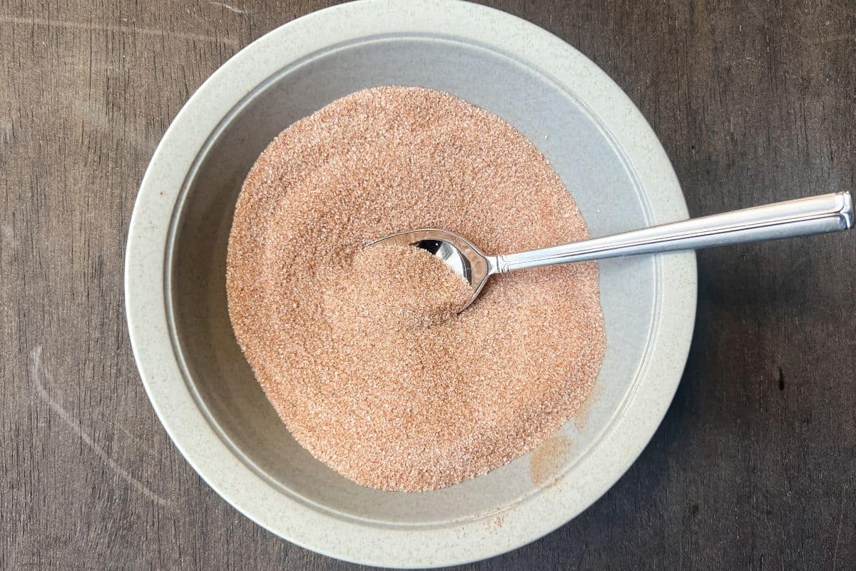 cinnamon sugar in a bowl with a spoon