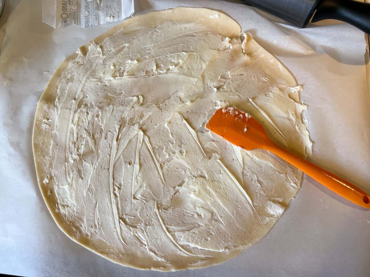 butter spread over a rolled pie dough