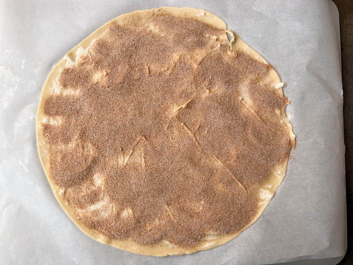 cinnamon sugar spread evenly over a pie dough