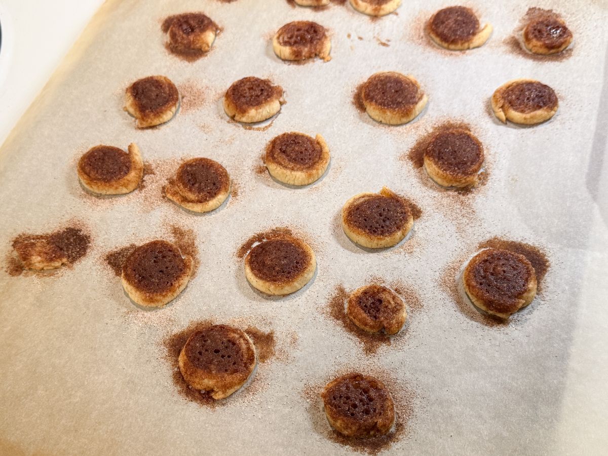 Cinnamon Sugar Pie Dough Cookies baked on a parchment lined cookie sheet