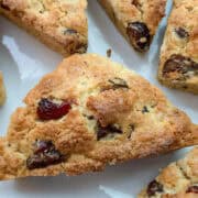dark chocolate cranberry scones on a white plate