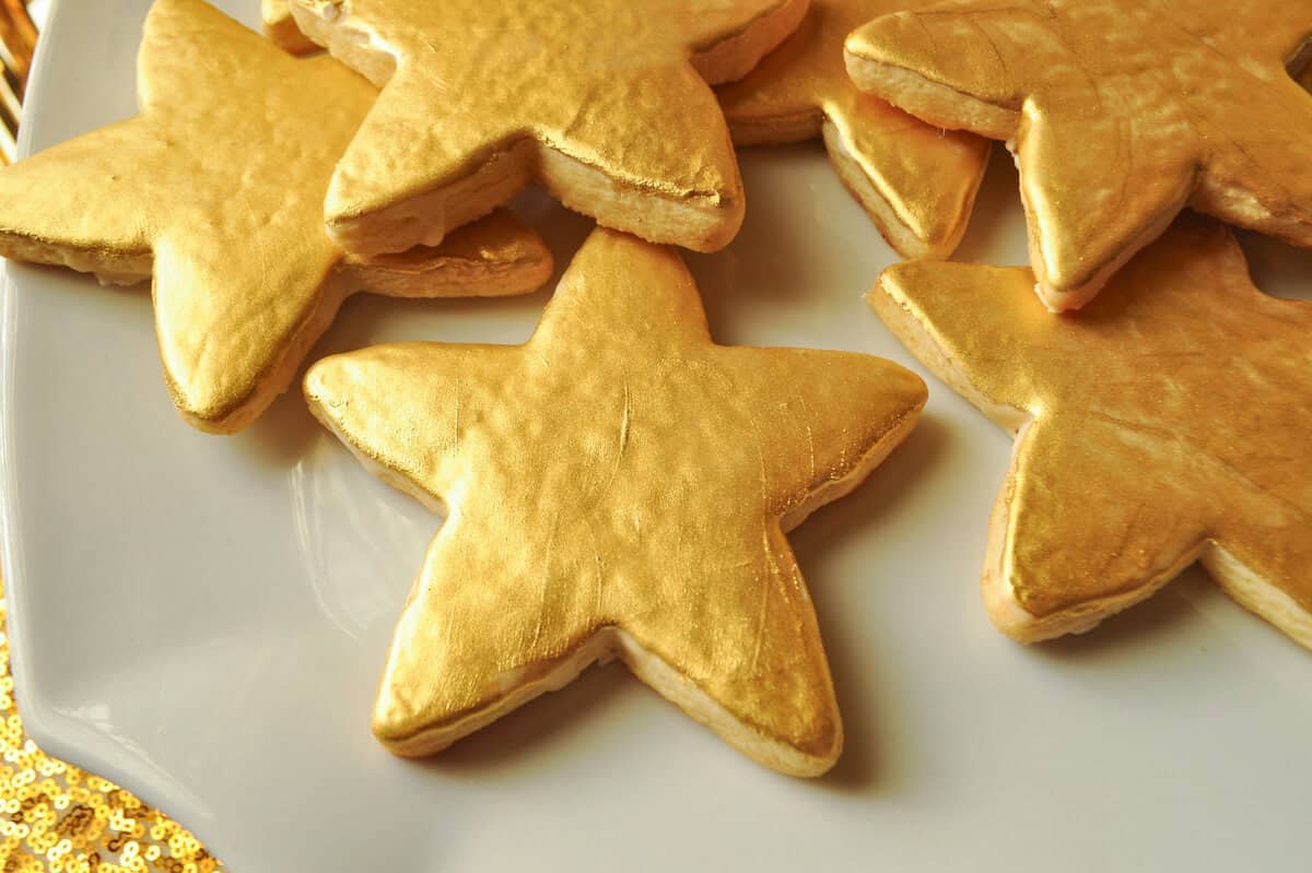 Gold Painted sugar cookies on a white plate