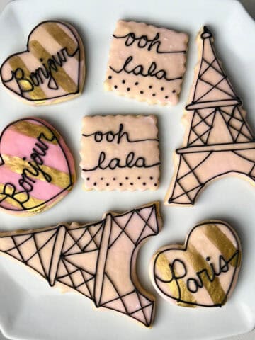 Parisian cookies on a white cake platter