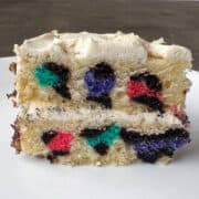 a cake slice cut to show the rainbow leopard print design inside