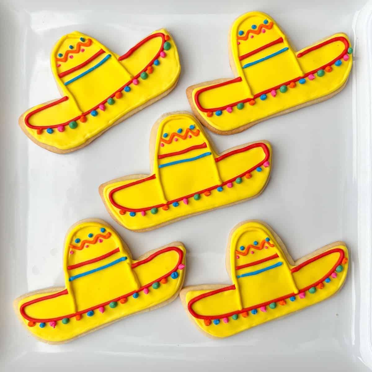 Mexican sombrero cookies on a white plate