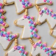a white plate filled with unicorn sugar cookies with royal icing