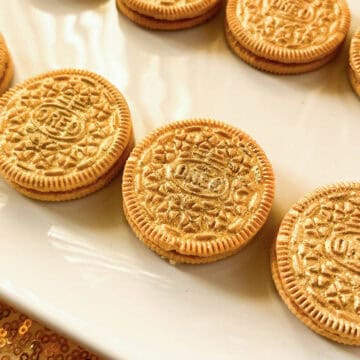 Gold Painted Oreos on a white plate