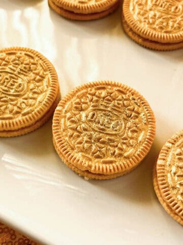Gold Painted Oreos on a white plate