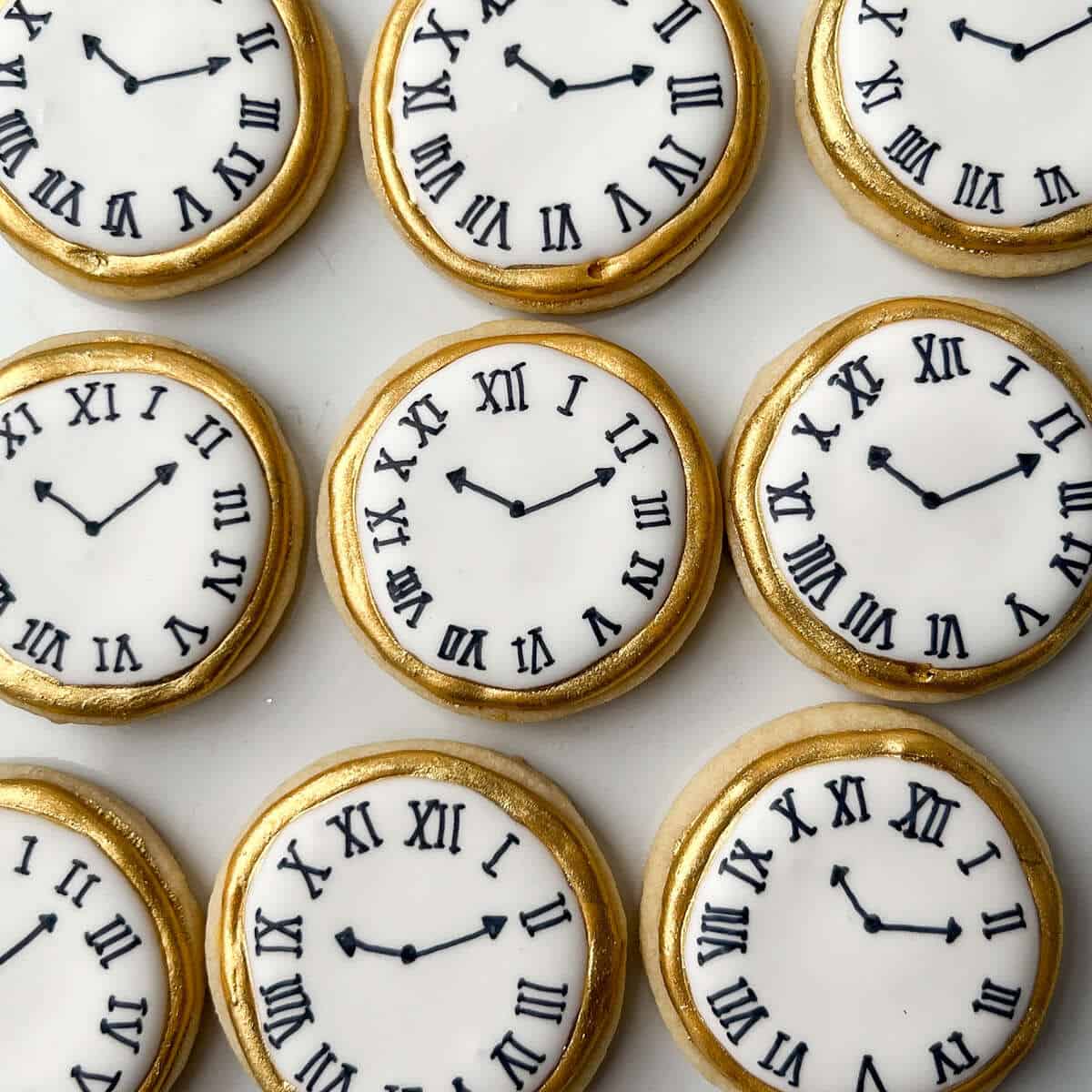 Pocket watch cookies on a white plate