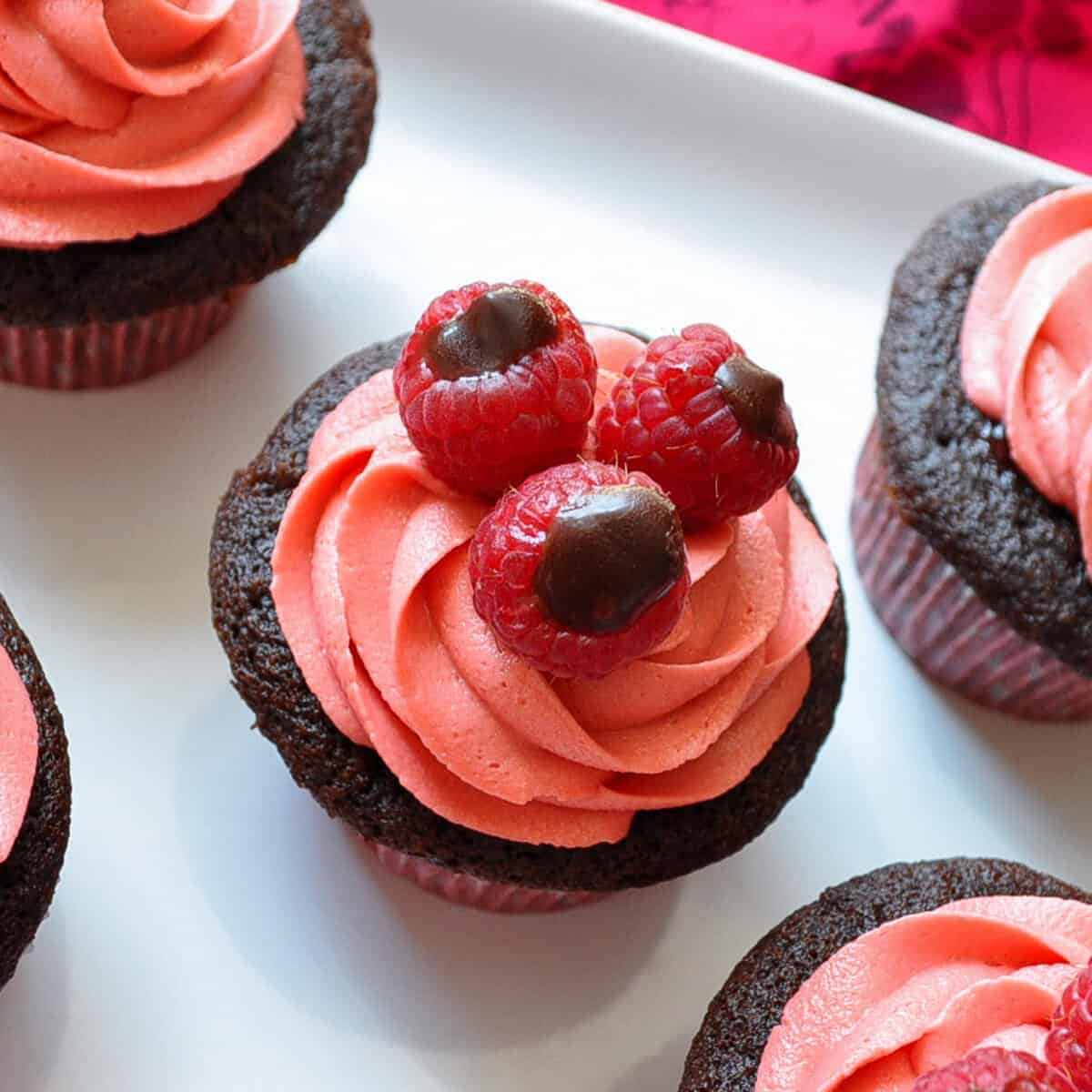 Chocolate Raspberry Truffle Cupcakes on a white platter