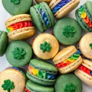 St. Patrick's Day Macarons in dark green and gold with rainbow buttercream filling