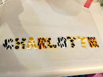 rolled fondant safari print letters spelling "Charlotte"