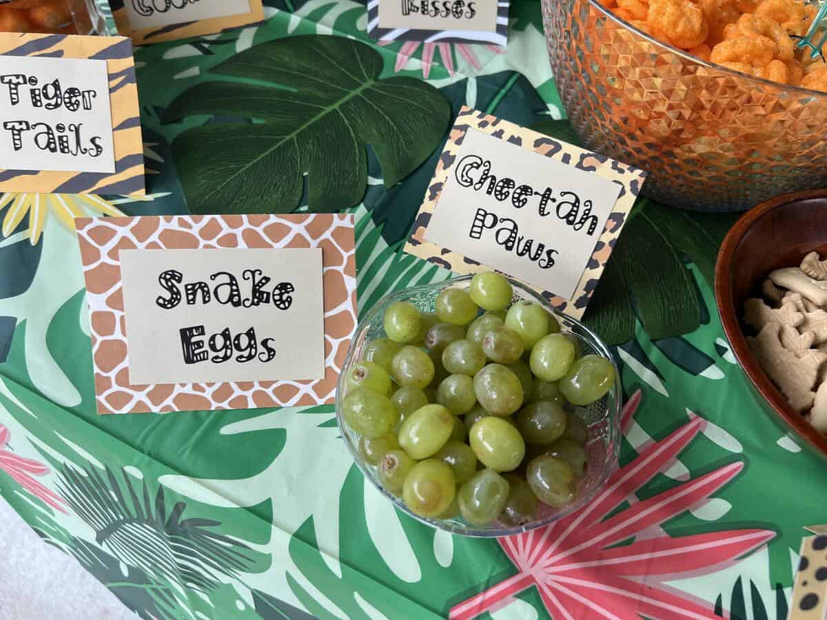 a bowl of green grapes labeled "Snake Eggs"