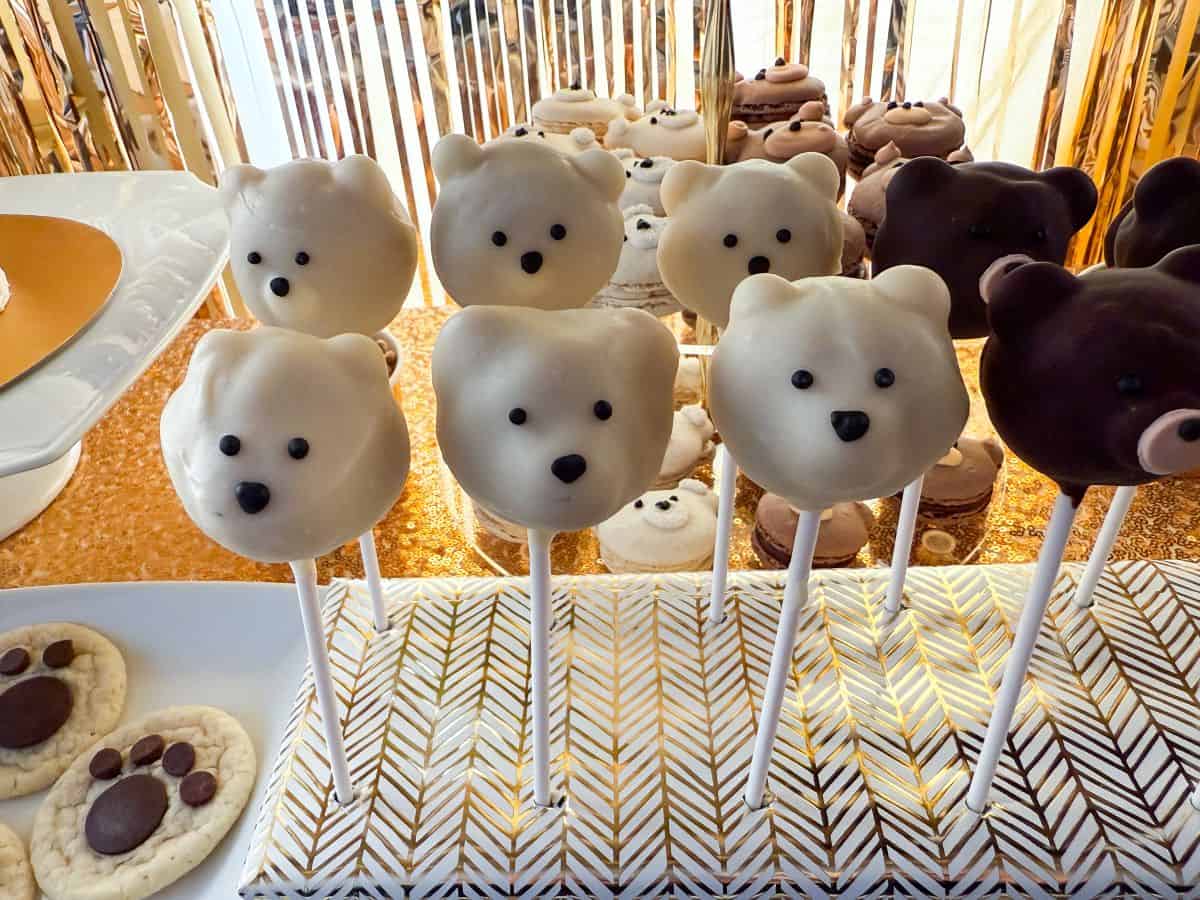 polar bear cake pops in a wrapped styrofoam block
