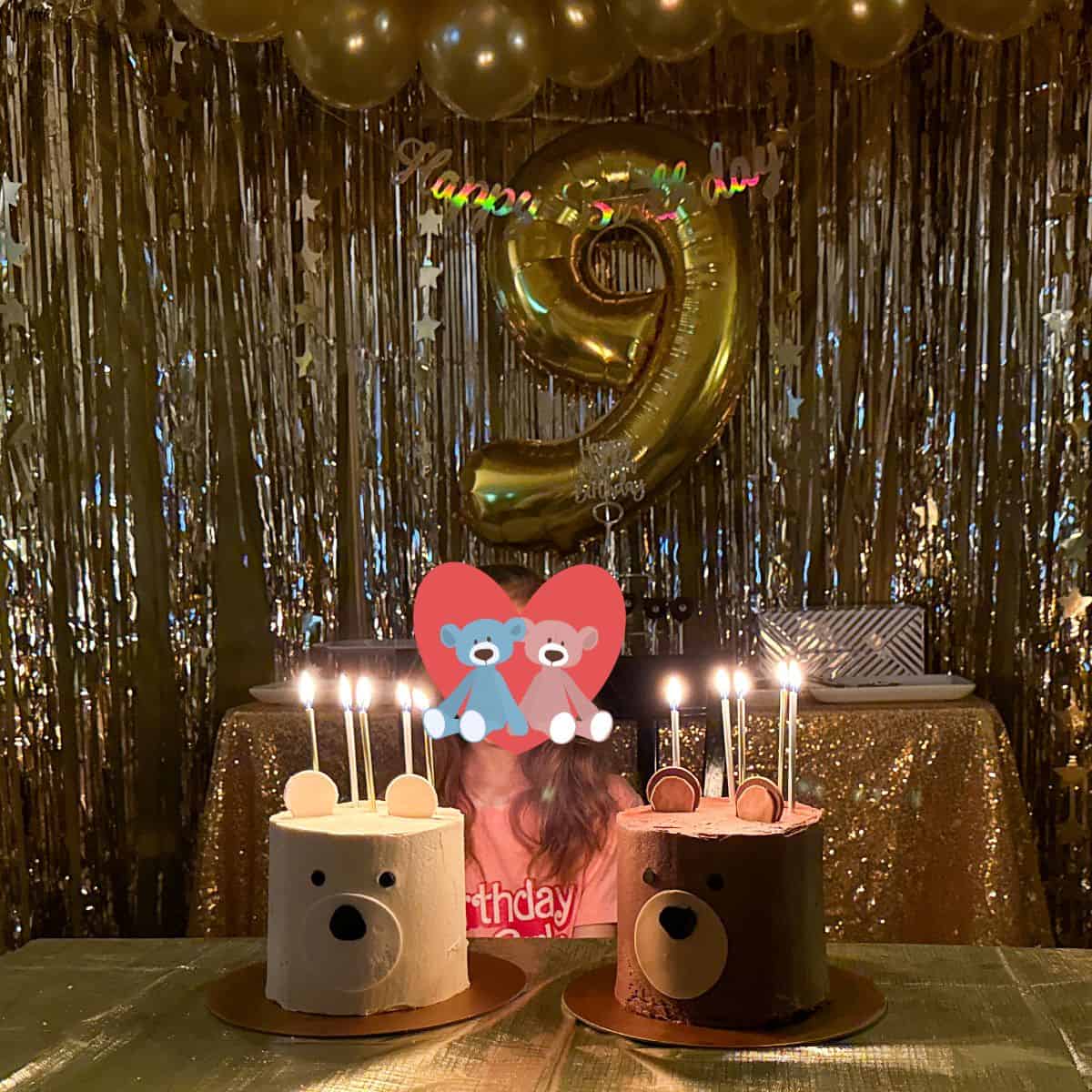 two bear birthday cakes with candles