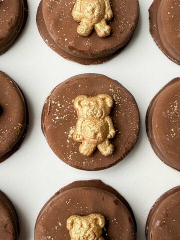 Golden Teddy Bear Chocolate Covered Oreos on a white plate