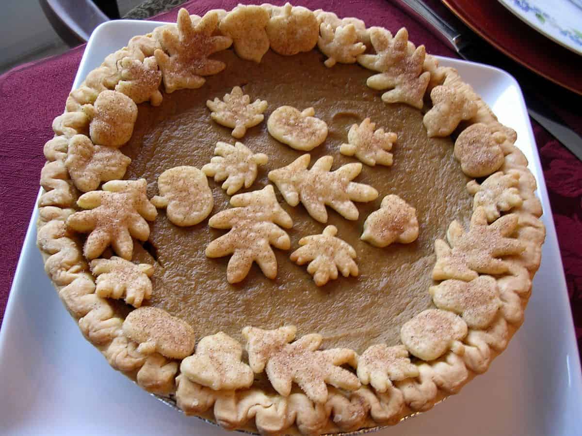 a Rich Pumpkin Pie on a square white plate