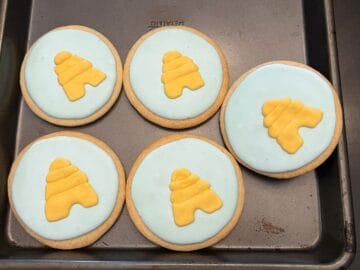 beehive cookies on a cookie sheet