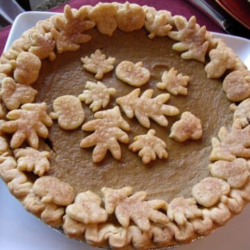a Rich Pumpkin Pie on a square white plate