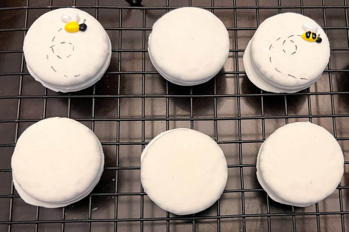Bumble bee Oreos on a cooling rack