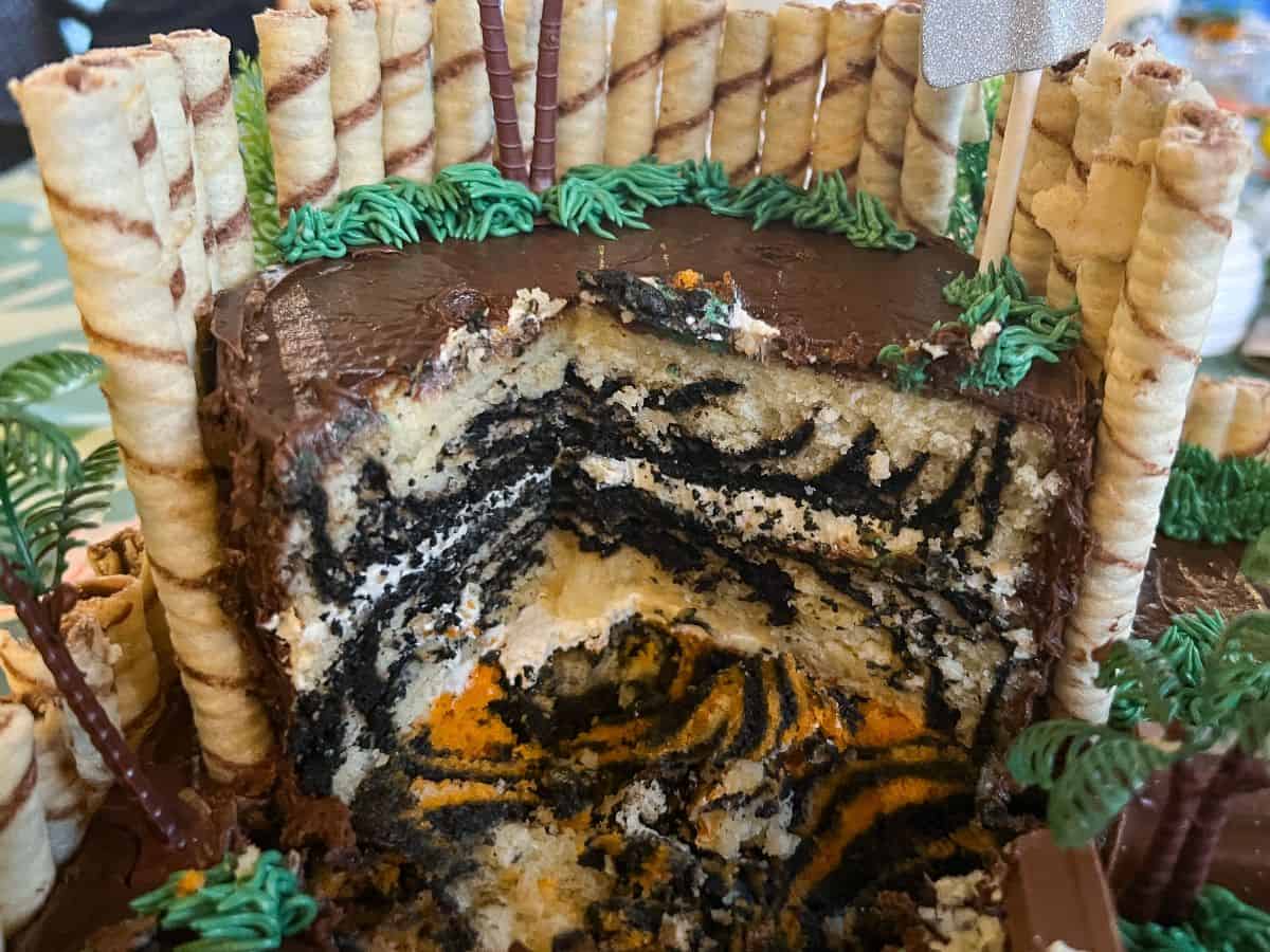 a zoo cake sliced into to reveal the zebra print