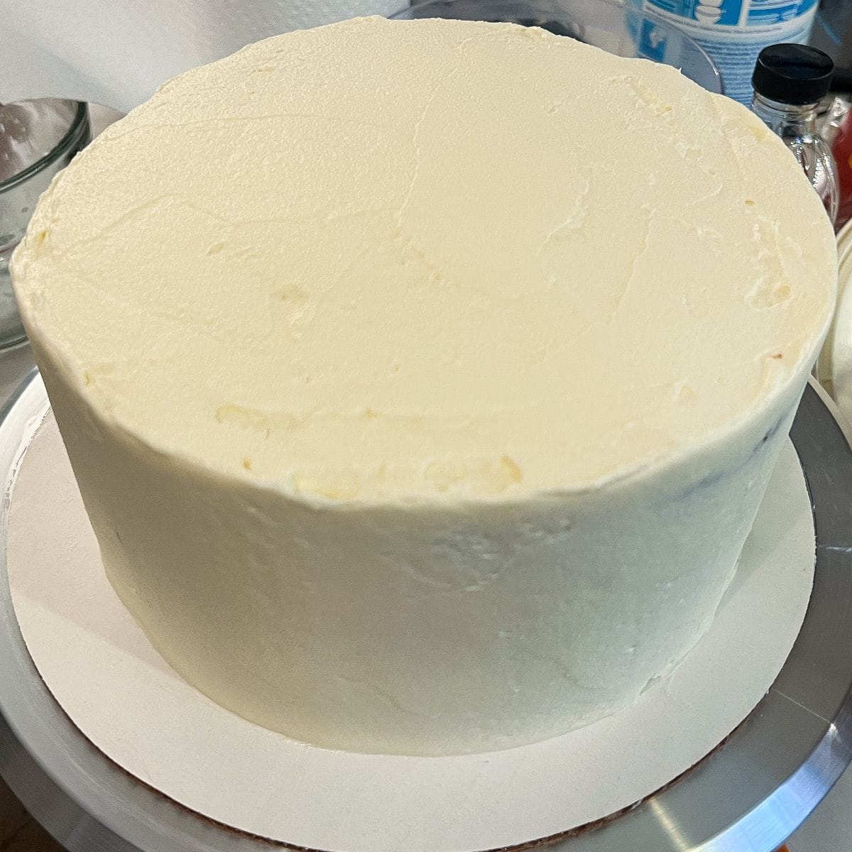a smoothed 3 layer carrot cake covered in cream cheese frosting
